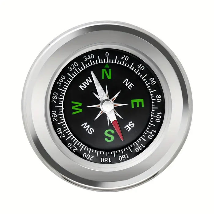 Compass with silver rim and black dial on a white background